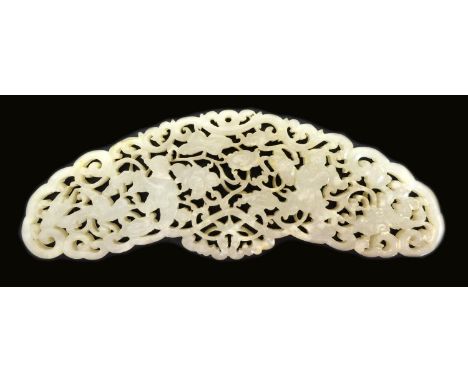 A Chinese Qing Dynasty, 19th century, jade carved pendant or plaque, of curved form, the body pierced and carved with two mal