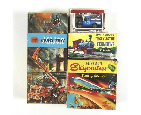 A collection of toys comprising a Corgi Simon Snorkel fire engine, a Louis Marx and Co four engined Skycruiser and a Tricky A