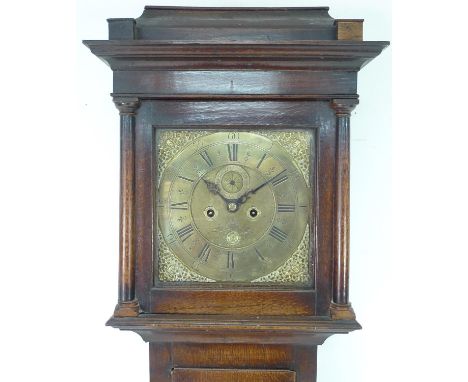 An 18th century long case clock with brass engraved face, subsidiary seconds dial, 11 inch dial, date aperture, four pillar t