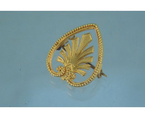 An unusual antique yellow metal heart form brooch with twisted edge detail and fan design centre, item is stamped JB (possibl
