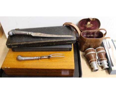 An oak cased set of twelve plated fish knives and forks, two cased sets of plated fish servers, a carving knife and fork set 