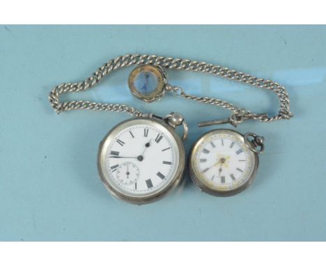 A lady's silver fob watch, a gents silver cased pocket watch, graduating silver watch chain with compass fob