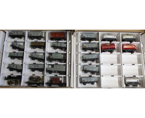 Two boxes with four trays each containing various Hornby Dublo tin plate tenders, forty seven items (mild play wear)