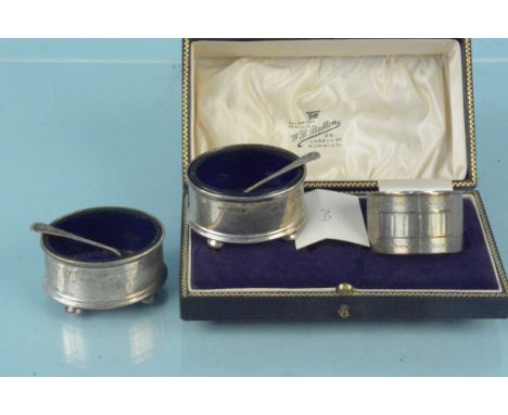 A collection of silver to include two oval salts with blue glass liners, spoons, a silver napkin ring plus a double napkin ri