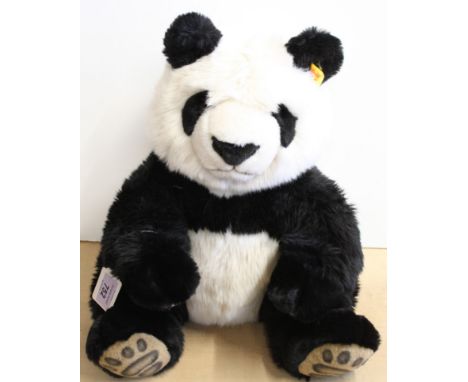 A Steiff panda, button and tag to ear, approx 43cm long