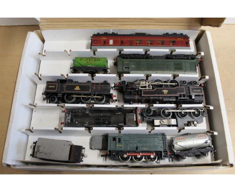 A box with two layers containing various Hornby locos and engines including 'Silver King', 'Duchess of Montrose' plus a few t