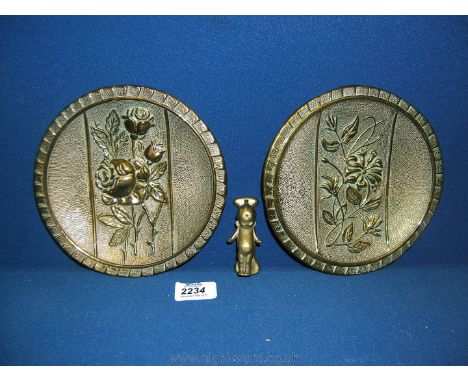 Two small Brass wall Plaques with floral decoration and a small door knocker in the form of a young child