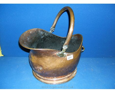 A Copper helmet Coal Scuttle.
