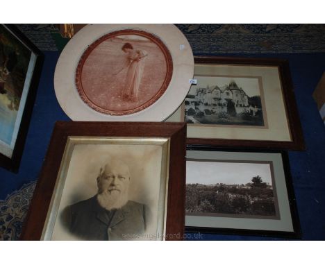 A white framed circular Print of a lady picking flowers, a black and white Print of a photograph depicting a house in Ledbury