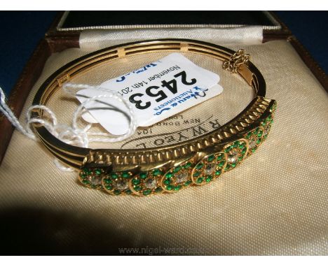 A 15ct Gold, Diamond and Emerald Bangle, 1920's/30's, 20 grams.