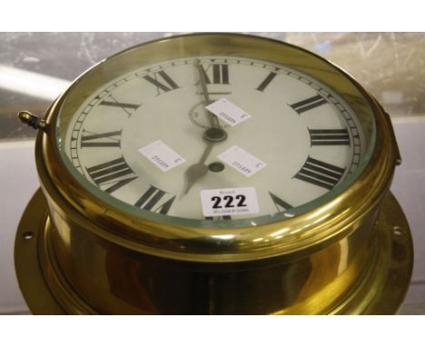  A brass ships clock,   the dial with Roman numerals and subsidiary seconds dial, 26cm  