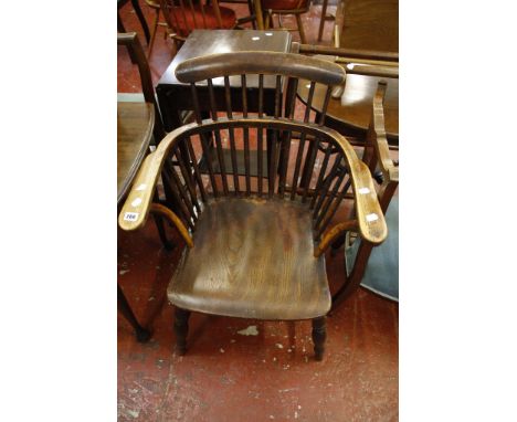  A 19th Century ash, elm and beech comb back armchair  