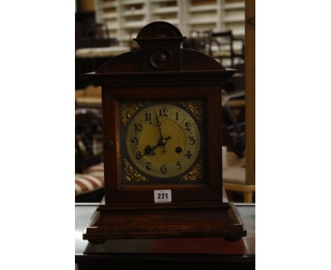  An Edwardian oak mantel clock,   40cm x 29cm  