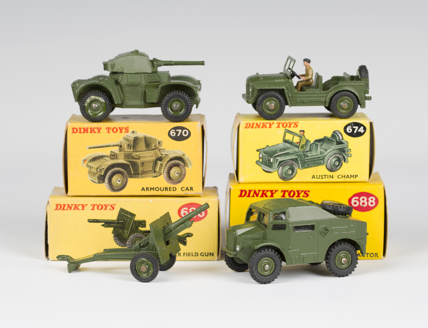 Three Dinky Toys army vehicles, comprising a No. 670 armoured car, a No