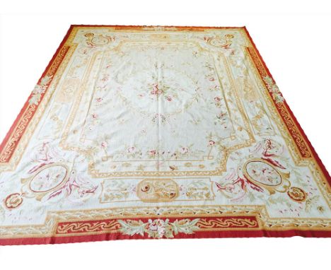 AUBUSSON NEEDLEPOINT CARPET, 305cm x 244cm, traditional savonnerie design of rose and vines within complimentary borders.