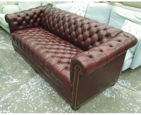 CHESTERFIELD SOFA, in buttoned burgundy leather, 86cm D x 73cm H x 191cm W. 