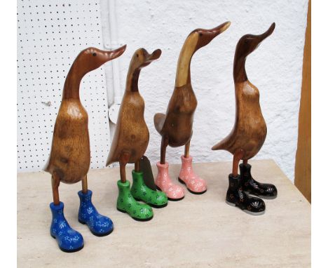 WOODEN 'RUNNER DUCKS', a set of four, retro art style carved solid wood with polished finish, 49cm H. (4)