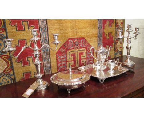 SILVER PLATED WARES, comprising a three piece coffee set, serving tray, lidded serving dish, and a pair of candelabra. (7)
