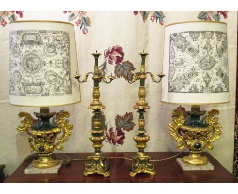 GILT LAMPS, a pair, each 72cm H, with green detail and patterned shades and two table candelabra, each 59cm H, (with faults).