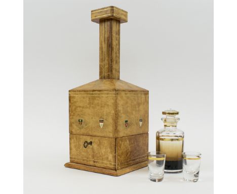 LEATHER TANTALUS, in the form of a decanter, hinged to reveal a fitted interior with glass decanter and two small tumblers, 3