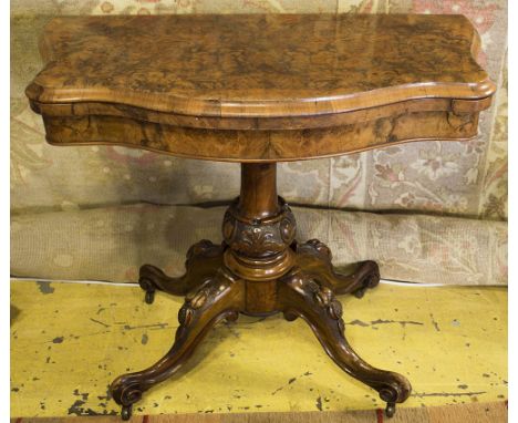 CARD TABLE, mid Victorian burr walnut of serpentine outline with a carved turned column and quadraform supports, 90cm W x 46c