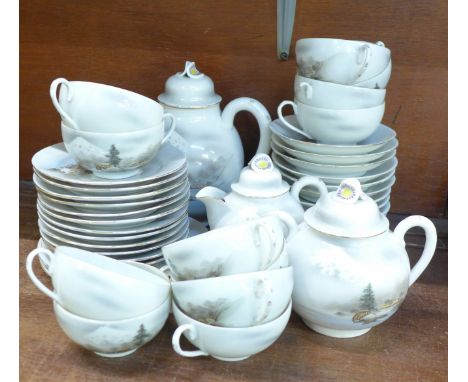 A Japanese eggshell tea service, twelve setting, one cup a/f 