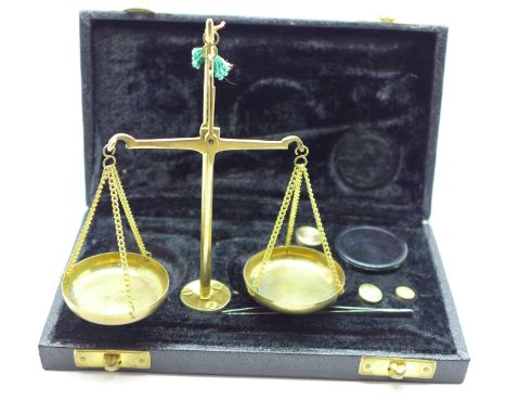 A cased set of balance scales and weights 
