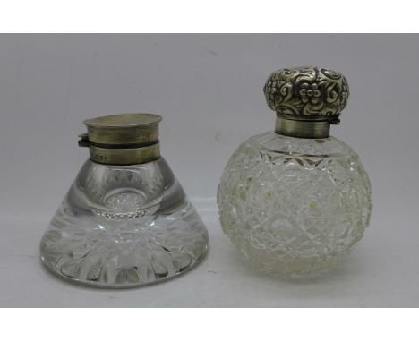 A Victorian silver topped ship's inkwell and a silver topped scent bottle, top dented, both hinges require repair 