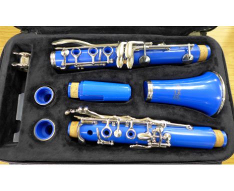 A sky blue Ferris clarinet, cased 
