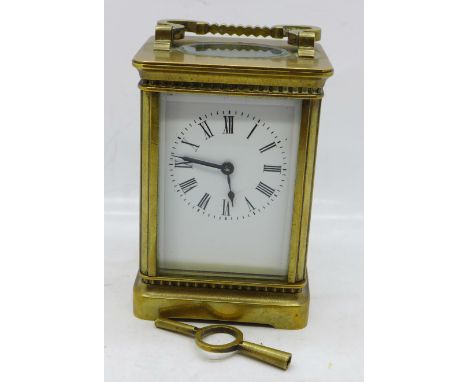 A French brass cased carriage clock with key 