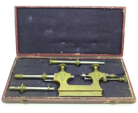 A watchmaker's lathe tool, cased 