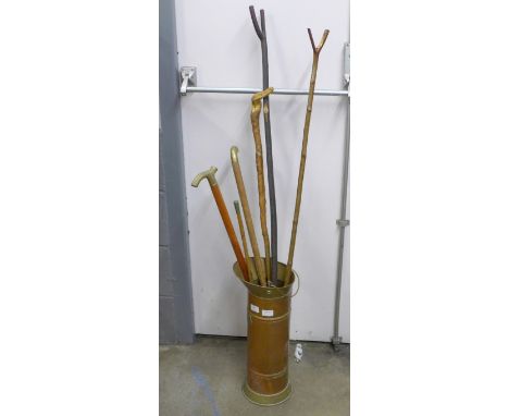 A Royal Army Service Corps swagger stick, five walking sticks and a coal scuttle **PLEASE NOTE THIS LOT IS NOT ELIGIBLE FOR P