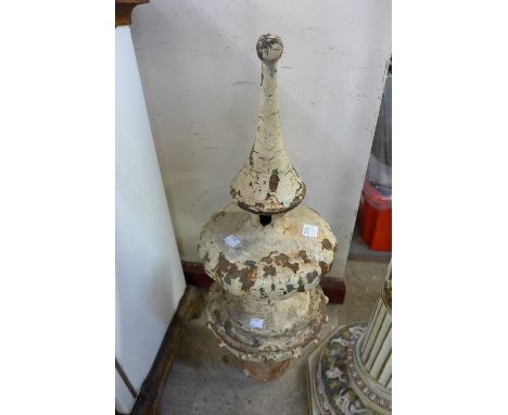 A cast iron finial