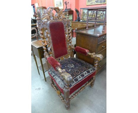 A Victorian Jacobean Revival carved oak armchair