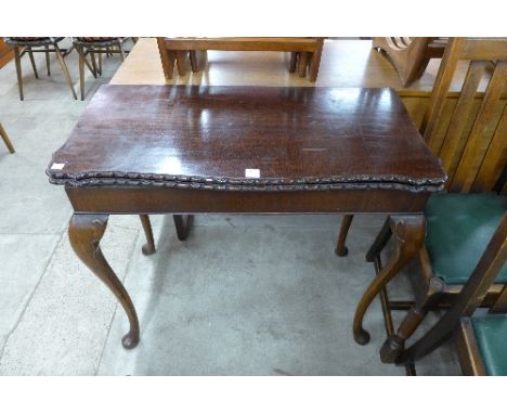 A mahogany card table