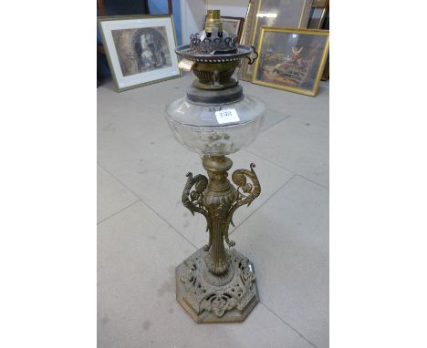 A French gilt metal oil lamp