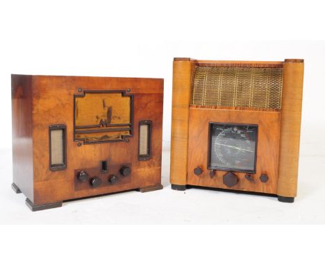 An early 20th century circa 1930s walnut veneer R.G.D valve radio receiver alongside another valve radio. The R.G.D having a 