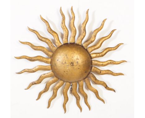 A 20th century gilt metal sunburst pendant ceiling light shade. The shade being in the form of a sunburst with waved rays ext