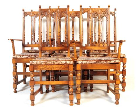 A set of eight 20th century Ercol old colonial dining chairs. Each having tapestry pad seat, with carved detailing to backs. 