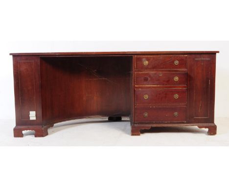 Vintage 20th century mahogany half moon office writing desk. The desk featuring a single set of three drawers to the right of