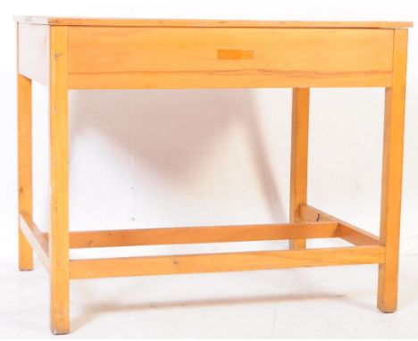 British Modern Design - A mid 20th century draughtsman's table / work bench. The table being raised on squared legs united by