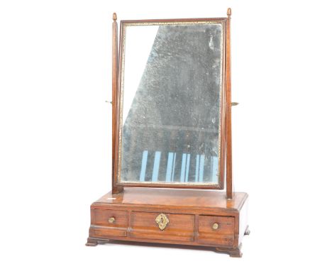 An 18th century Queen Anne mahogany toilet swing mirror. The mirror having gilt edged mirrored glass raised between squared u