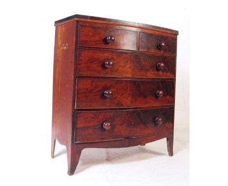 A George III 19th century mahogany chest of drawers. Of rectangular form, bow front with two short drawers over three full le