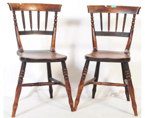 A pair of early 19th century George III North Country Windsor childs beech and elm dining chairs. The chairs having a spindle