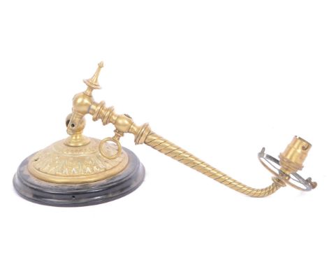 An 19th century wrythen twist brass wall sconce. The sconce featuring a tapered arm with wrythen twist style decoration termi