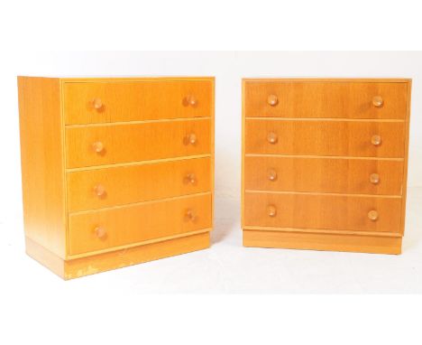Meredew - A pair of retro mid 20th century light oak Meredew chest of drawers. The chest of drawers having a bank of four dra