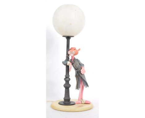 A 20th Century vintage Italian Pink Panther novelty lamp light depicting the iconic character leaning on a lamp post in a fab