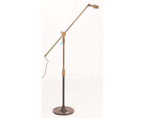20th century cast iron and brass floor&nbsp;standing light lamp. Having brass light fixing to top with knurled twist turn whe