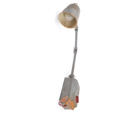 A 20th Century retro memlite metal industrial anglepoise light / lamp having a circular shade with hinged bar in grey colour.