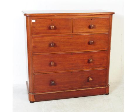 A Victorian 19th century solid mahogany chest of drawers. Raised on plinth base with short and deep drawers having a caddy to